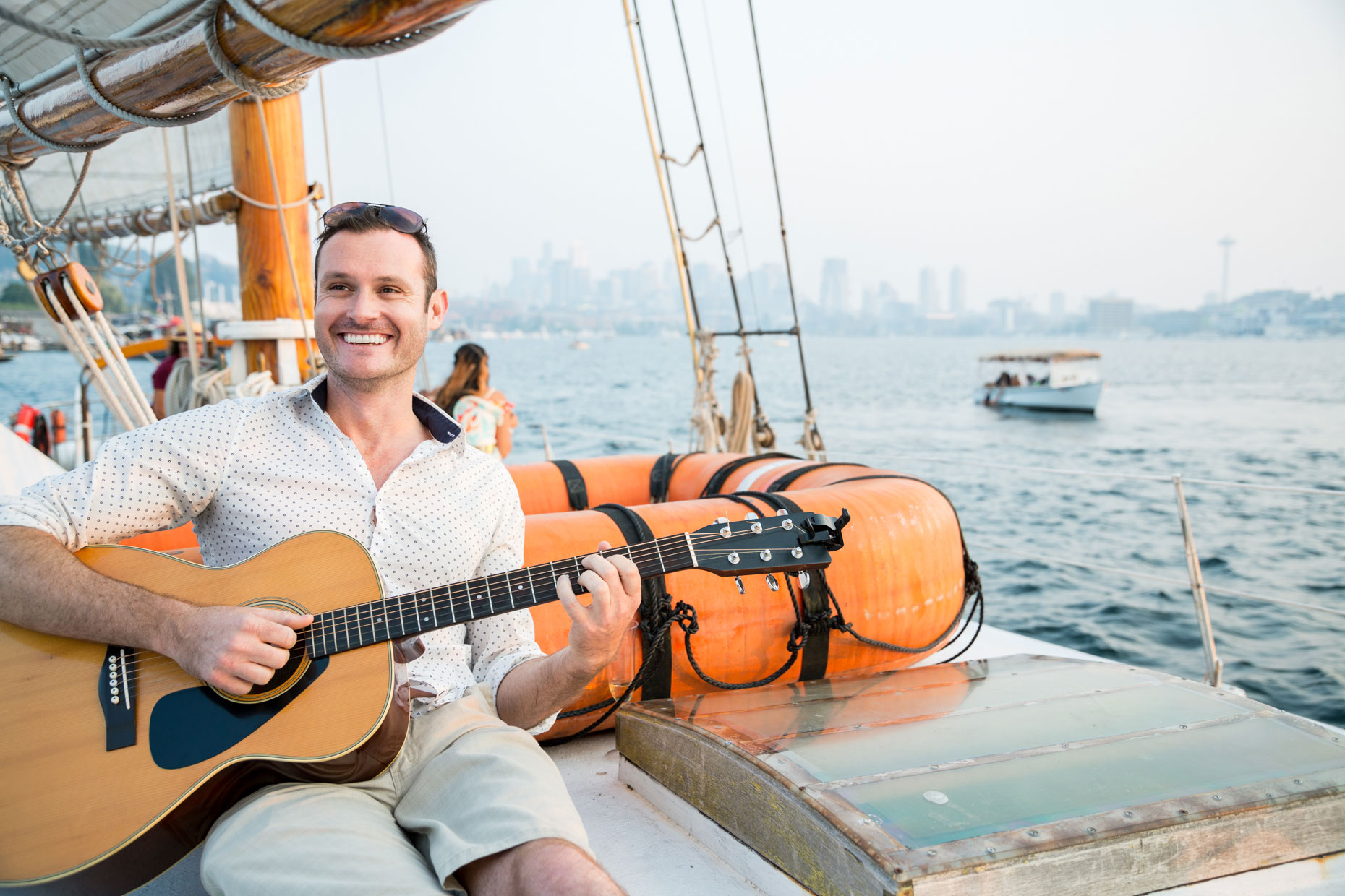 Guitar player on sailboat