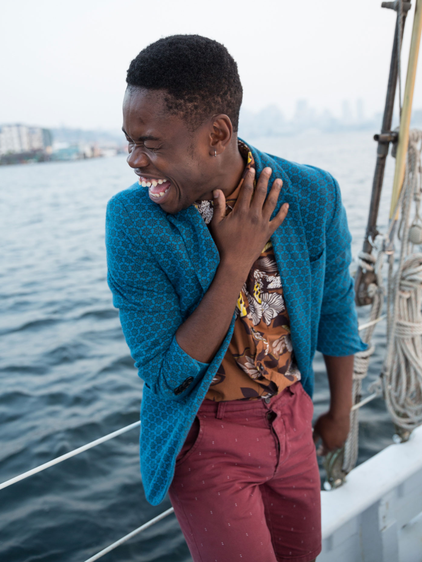 Laughing man on sailboat